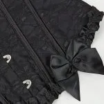 Corset victorien noir jacquard (vue détail nœud) Corset victorien noir jacquard (vue détail nœud)