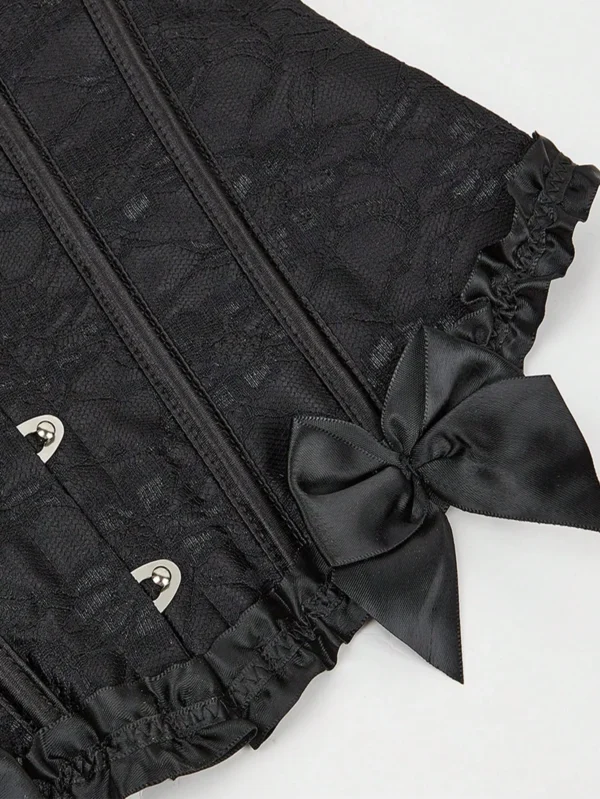 Corset victorien noir jacquard (vue détail nœud) Corset victorien noir jacquard (vue détail nœud)